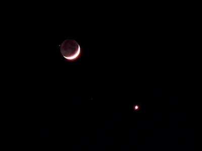 Image of Moon with earthshine and nearly occulting a star, and the planet Venus